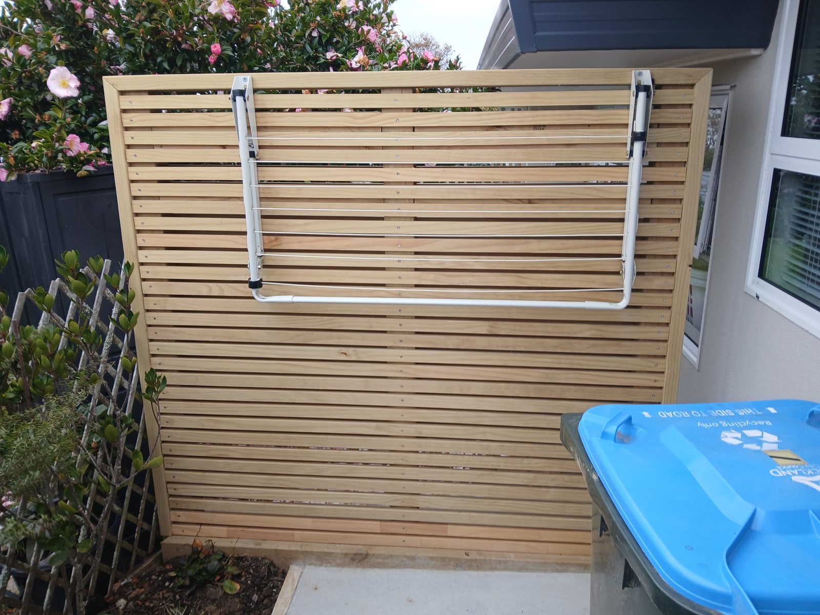 Horizontal timber privacy fence beside an Auckland home